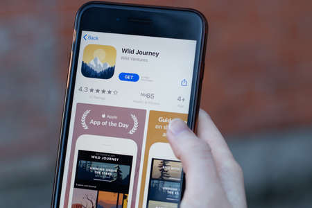 New York, USA - 1 May 2020: Wild Journey app logo close-up on phone screen, Illustrative Editorial.のeditorial素材