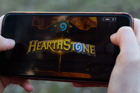 New York, USA - 1 May 2020: HearthStone game app logo close-up on phone screen, Illustrative...