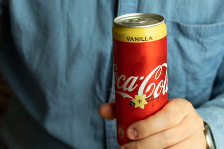 Los Angeles, California, USA - 1 June 2020: Coca-Cola Vanilla Can in hand close-up, Illustrative...