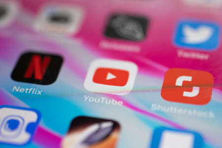 Moscow, Russia - 1 June 2020: Netflix and Youtube app logo icon macro close-up, Illustrative...