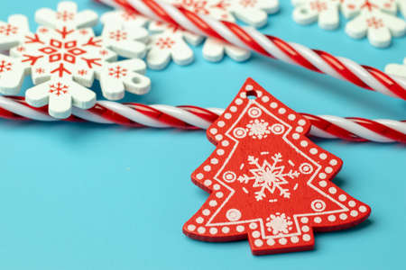 Copy space on blue background near Christmas toy tree.の写真素材