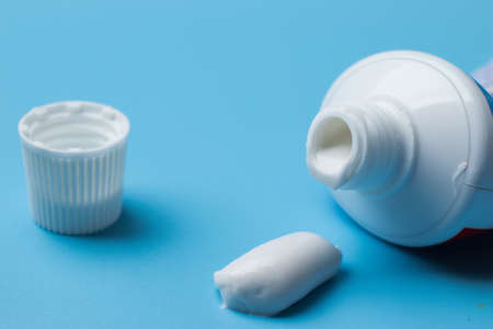 Morning hygiene and self-care concept. Toothpaste close-up on blue background.の写真素材