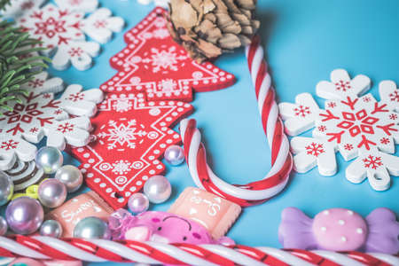 Flat lay of Christmas decoration background. New Year toys on blue background top view.の写真素材
