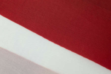 Pink, white and red fabric tissue texture background.