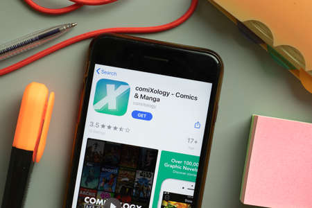 New York, USA - September 29, 2020: comiXology mobile app logo on phone screen close up, Illustrative Editorial.のeditorial素材