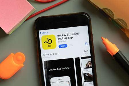 New York, USA - 29 September 2020: Booksy Biz mobile app logo on phone screen close up, Illustrative Editorial.のeditorial素材