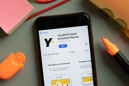 New York, USA - September 29, 2020: YCLIENTS Work Schedule Planner mobile app logo on phone screen close up, Illustrative Editorial.のeditorial素材