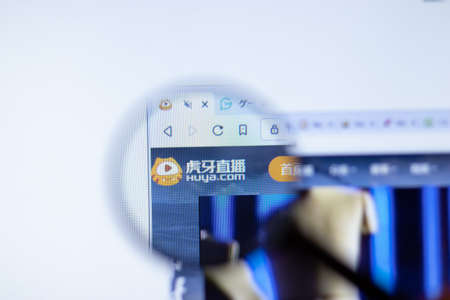 New York, USA - September 29, 2020: huya.com Huya company website with logo close up, Illustrative Editorial.のeditorial素材