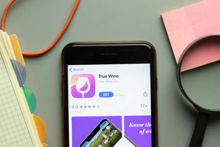 New York, USA - 26 October 2020: True Wine mobile app logo on phone screen close up, Illustrative Editorial.のeditorial素材