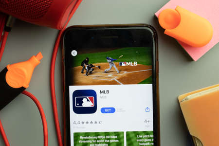 New York, United States - 7 November 2020: Phone screen close-up with MLB mobile app on display, Illustrative Editorial.のeditorial素材