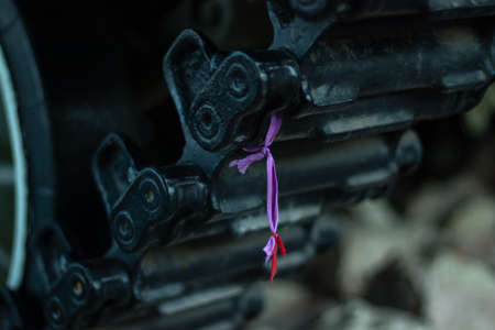 Ribbon on a tank track. The concept of pacifism and rejection of war. Memory of the victims of the...
