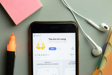 New York, USA - 1 December 2020: The Art of Living mobile app icon on phone screen top view, Illustrative Editorial.のeditorial素材