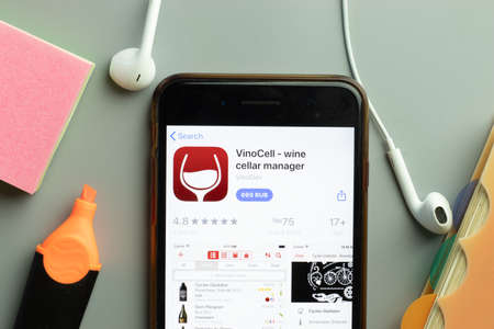New York, USA - 1 December 2020: VinoCell mobile app icon on phone screen top view, Illustrative Editorial.のeditorial素材