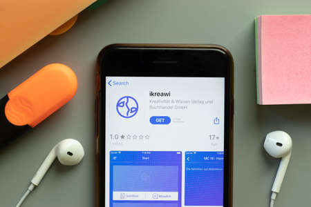 New York, USA - 1 December 2020: ikreawi mobile app icon on phone screen top view, Illustrative Editorial.のeditorial素材