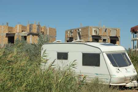 Trailer park concept, van in forest. Camper motorhome, house on wheels.