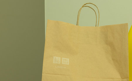 Moscow, Russia - 5 December 2020: UNIQLO logo on paper bag, Illustrative Editorial.のeditorial素材