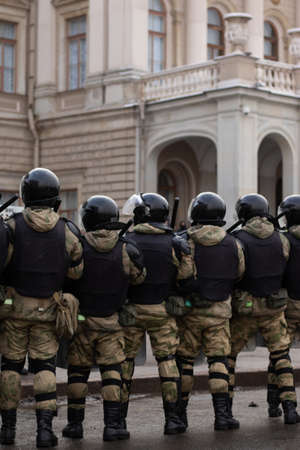 Saint Petersburg, Russia - 31 January 2021: Military force squad on street, protest in Russia. Riot...