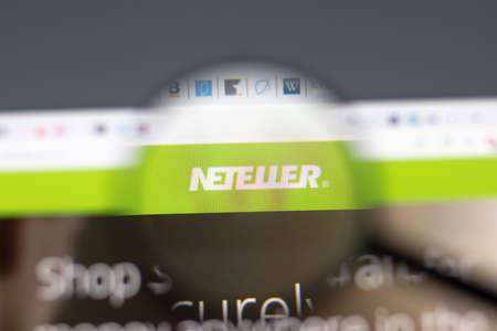 New York, USA - 15 February 2021: Neteller website in browser with company logo, Illustrative Editorialのeditorial素材