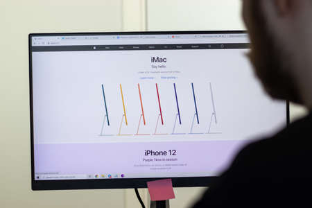 New York, USA - 26 April 2021: Apple website page on screen, man using service, Illustrative Editorialのeditorial素材