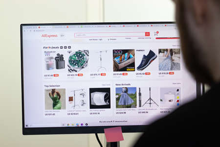 New York, USA - 26 April 2021: AliExpress website page on screen, man using service, Illustrative...