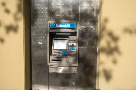 Barcelona, Spain - 5 November 2021: Sabadell bank ATM, Illustrative Editorial.のeditorial素材