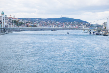 Budapest, Hungary - 1 November 2021: Danube river and bridge in Budapest, dividing Buda and Pest, Illustrative Editorial.のeditorial素材