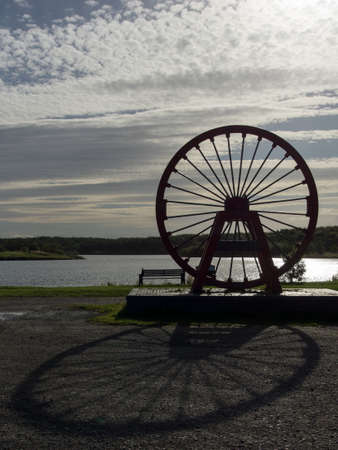 Shaft Head Wheel Mining Monument At Sunset