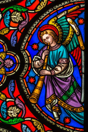 Stained Glass Window Of An Angel With A Trumpet