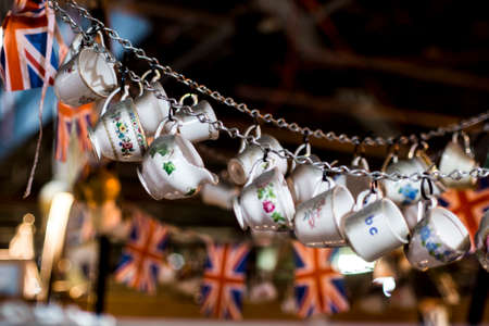 Cups of tea and UK flags in a market in Londonの写真素材