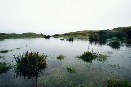 Foggy lake in the mountains in winter in north Spain