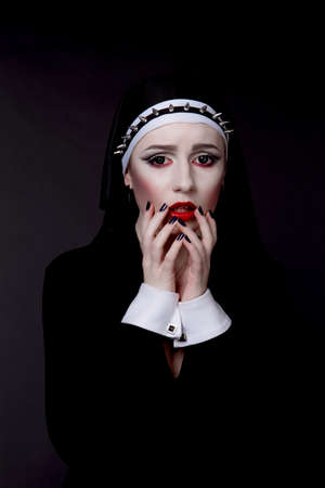 Halloween. Girl dressed in evil sexy nunの写真素材