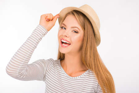 cheerful cute girl with hat smilingの写真素材