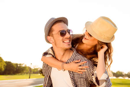 happy couple in love smiling at sunsetの写真素材