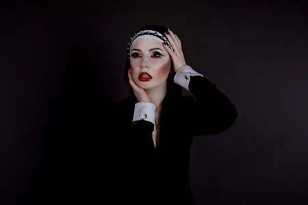 Halloween. Girl dressed in evil sexy nunの写真素材