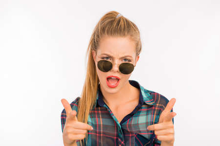 Funny attractive gesturing girl fooling around with glassesの写真素材