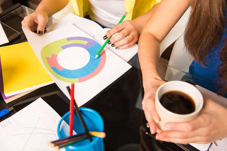 Closeup photo of a girl showing business projectの写真素材