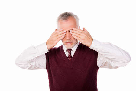 Handsome confident businessman with gray beard shutting eyesの写真素材