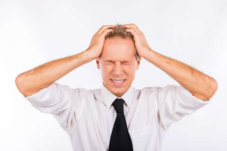 Mature office worker suffering from headache