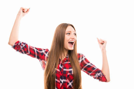 Portrait of young excited girl on white backgroundの写真素材