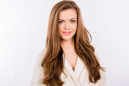 portrait of beautiful girl on white background wearing white bathrobeの写真素材