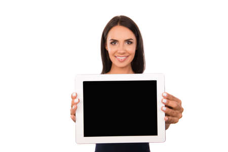 Attractive young woman showing a screen of tablet