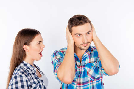 Annoyed young woman shouting at her boyfriend