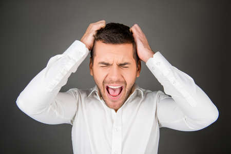 Handsome depressed man  holding his head