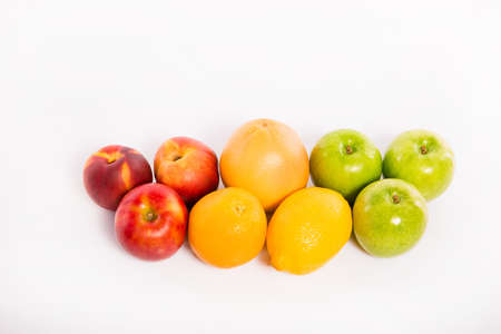 Colorful fruits standing  on white isolated background.の写真素材