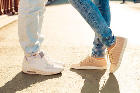 Closeup photo of nice couple in love on the bridge standing togetherの写真素材