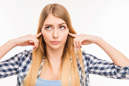 Close up photo of  girl  closing her ears
