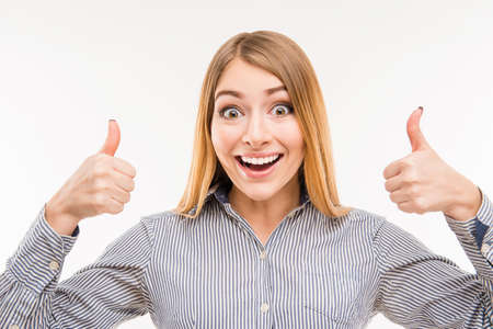 Cheerful young businesswoman gesturing LIKE, close up photo