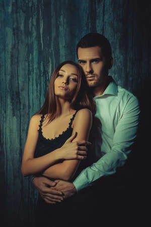 Handsome man embracing passionately  his sexy womanの写真素材
