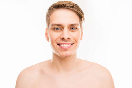 Close up portrait of cheerful hansome young healthy manの写真素材