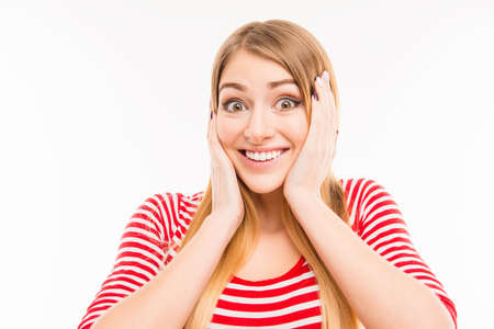 Surprised girl  touching her faceの写真素材